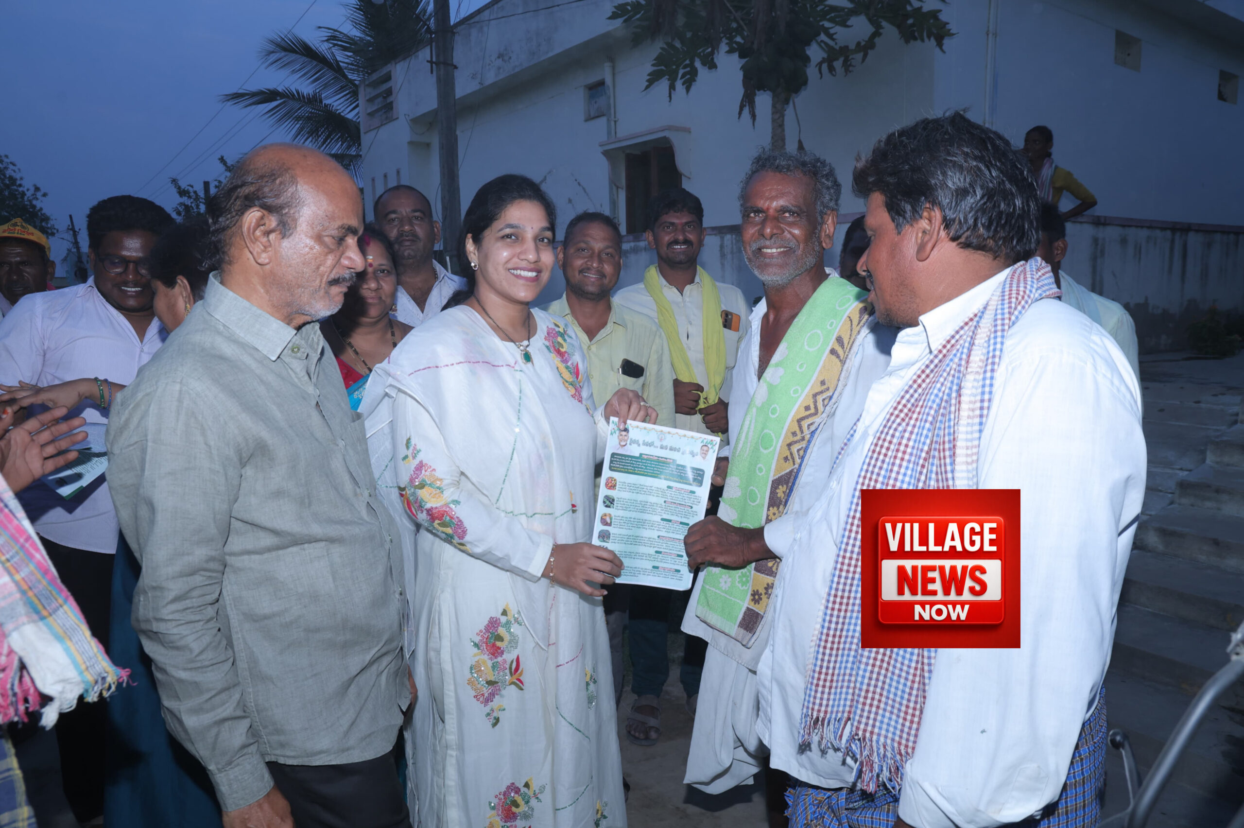 Dr. Lakshmi talking to farmers in the constituency